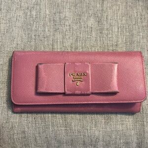 Well loved Prada pink bow wallet